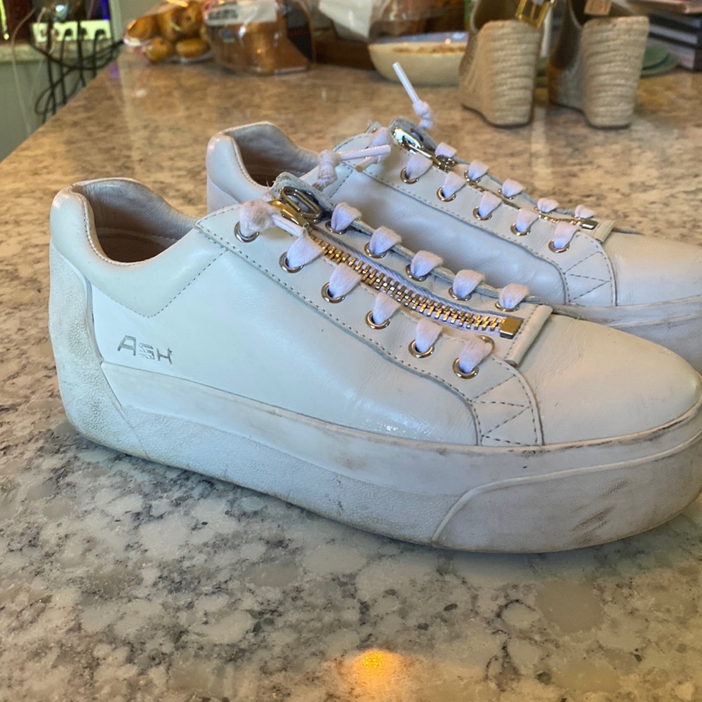 Mildly worn Ash stylish sneakers with red star! Zippers and silver accents.